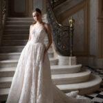Fabric is Lace & Tulle, silhouette is Ball Gown, neckline is Sweetheart, sleeve style is Strapless, train is Chapel, waistline is Basque, embellishment is Floral Lace Appliqué, back is Corset Back, color is Champagne/Ivory/Nude, style is Romantic Couture, Sheer bodice, pockets