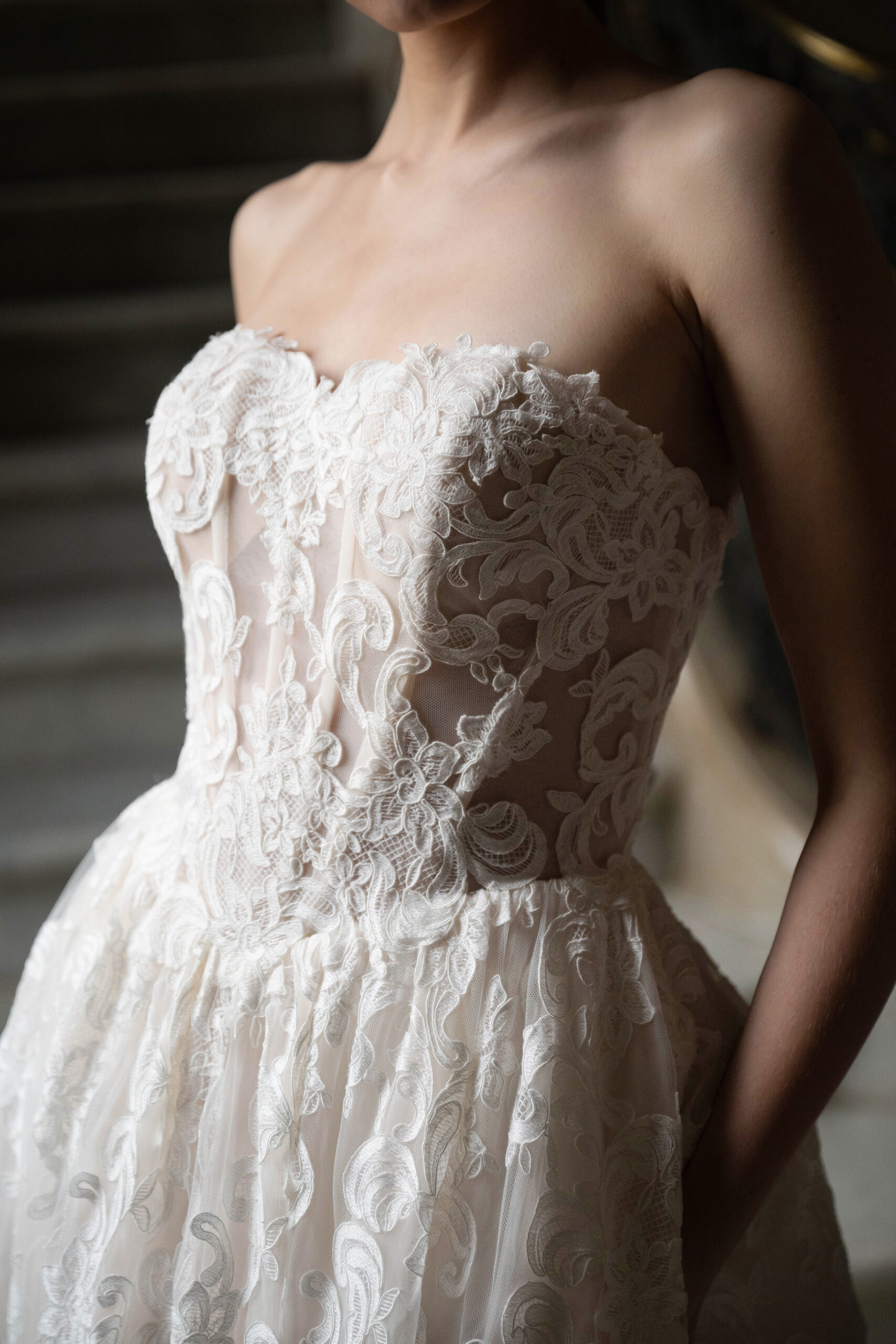 Fabric is Lace & Tulle, silhouette is Ball Gown, neckline is Sweetheart, sleeve style is Strapless, train is Chapel, waistline is Basque, embellishment is Floral Lace Appliqué, back is Corset Back, color is Champagne/Ivory/Nude, style is Romantic Couture, Sheer bodice, pockets