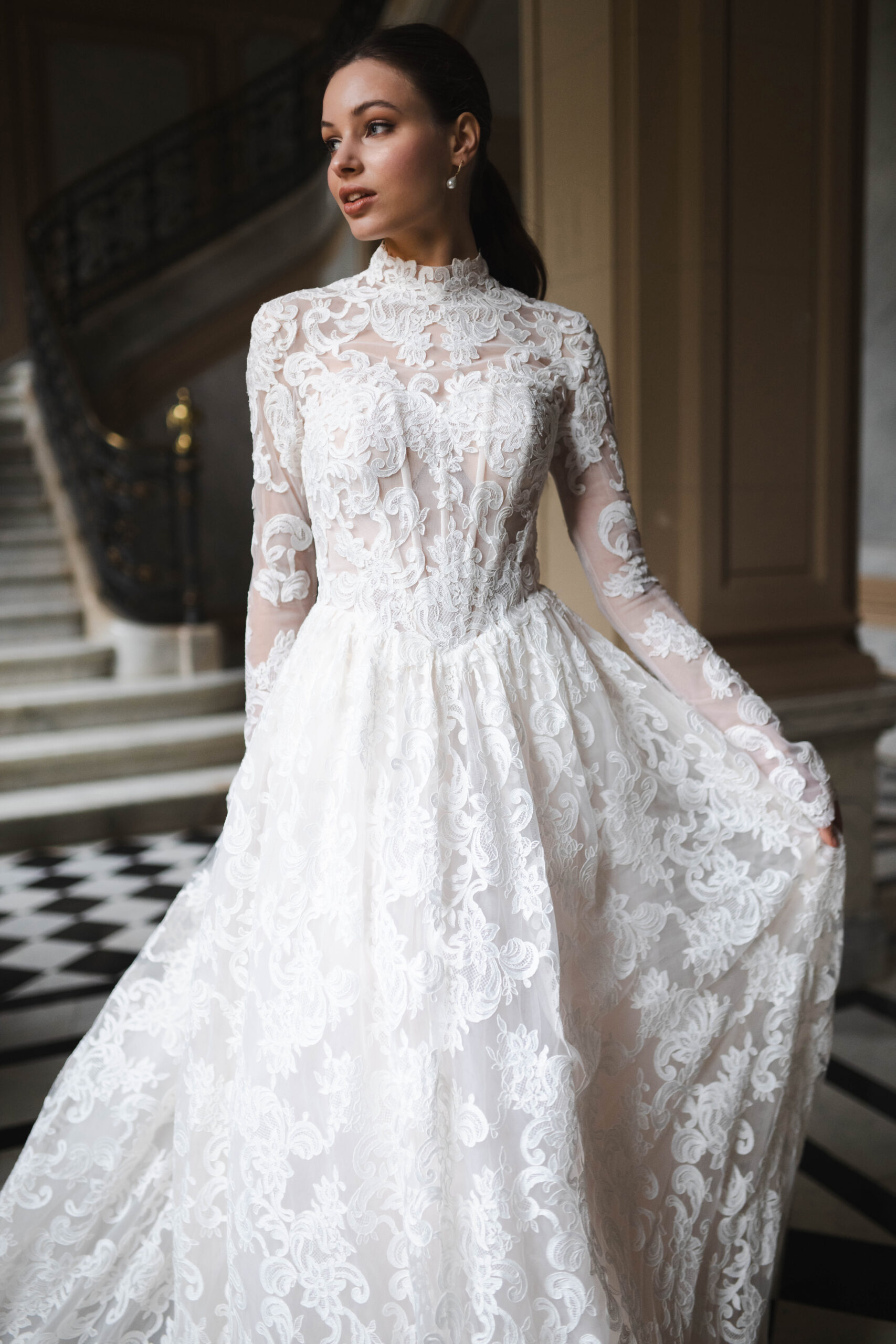 Fabric is Sheet lace, silhouette is Fitted jacket overlay, neckline is High neck, sleeve style is Long sleeves, train is None (overlay jacket only), waistline is Natural, fitted to gown, embellishment is Intricate lace appliqué, back is Sheer illusion with button closure, color is Ivory/Nude, style is Regal, Vintage-inspired, Detachable, versatile for ceremony-to-reception transformation