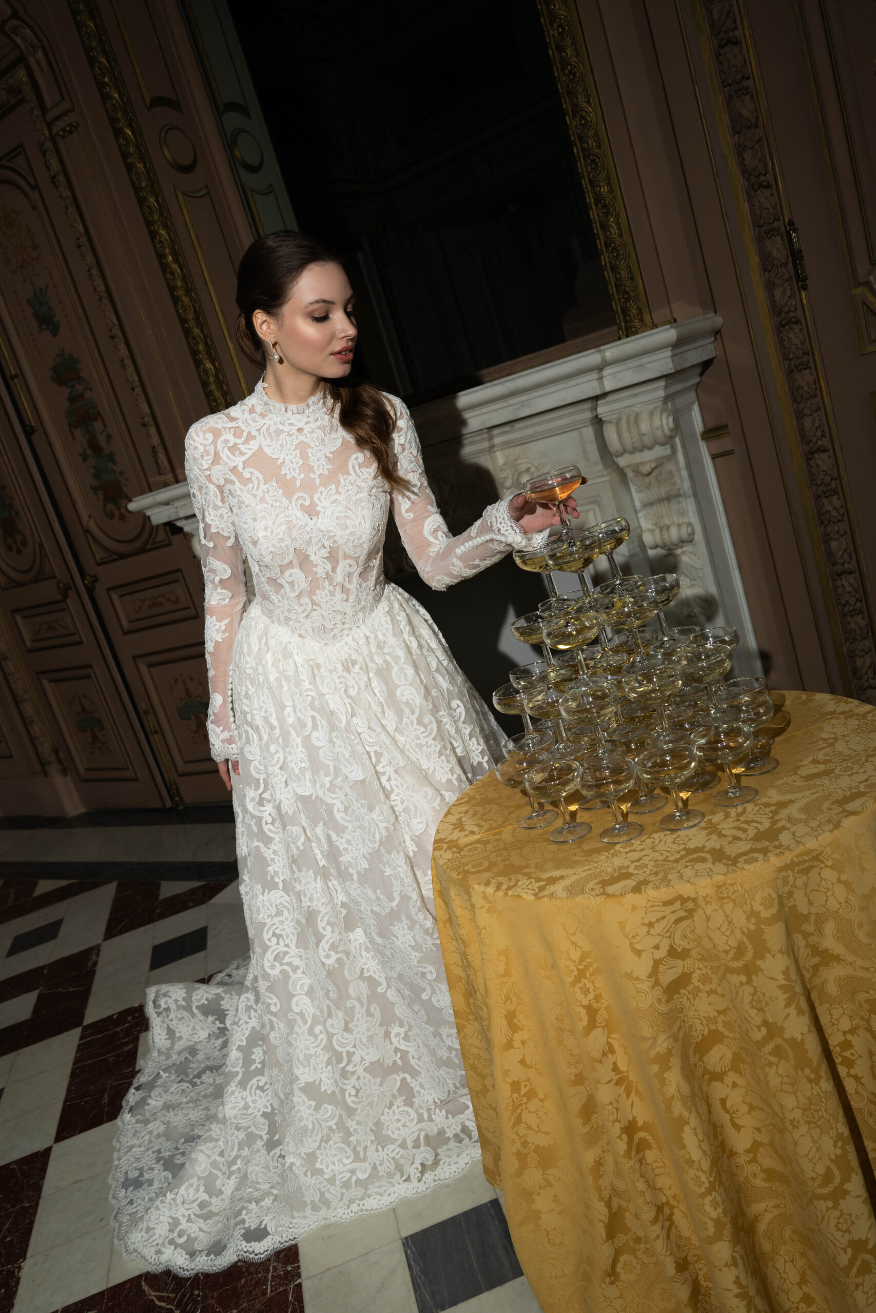 Fabric is Sheet lace, silhouette is Fitted jacket overlay, neckline is High neck, sleeve style is Long sleeves, train is None (overlay jacket only), waistline is Natural, fitted to gown, embellishment is Intricate lace appliqué, back is Sheer illusion with button closure, color is Ivory/Nude, style is Regal, Vintage-inspired, Detachable, versatile for ceremony-to-reception transformation