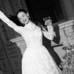 Fabric is Sheet lace, silhouette is Fitted jacket overlay, neckline is High neck, sleeve style is Long sleeves, train is None (overlay jacket only), waistline is Natural, fitted to gown, embellishment is Intricate lace appliqué, back is Sheer illusion with button closure, color is Ivory/Nude, style is Regal, Vintage-inspired, Detachable, versatile for ceremony-to-reception transformation