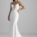 Fabric is Crepe & Lace, silhouette is Sheath, neckline is Illusion Plunge, sleeve style is Spaghetti Straps, train is Chapel with Lace Appliqué, waistline is Natural, embellishment is Floral Lace Appliqué, back is Illusion Low Back, color is Ivory/Nude, style is Modern Romantic, Sheer bodice, Button-back detailing, Lightweight crepe skirt