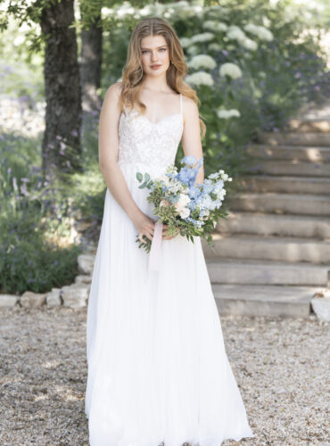 Fabric is Chiffon & Lace, silhouette is A-line, neckline is Sweetheart, sleeve style is Spaghetti Straps, train is Chapel, waistline is Natural, embellishment is Beaded Lace Appliqué, back is Low Scoop with Buttons, color is Ivory/Champagne/Nude, style is Romantic Garden, Lightweight, ethereal flow
