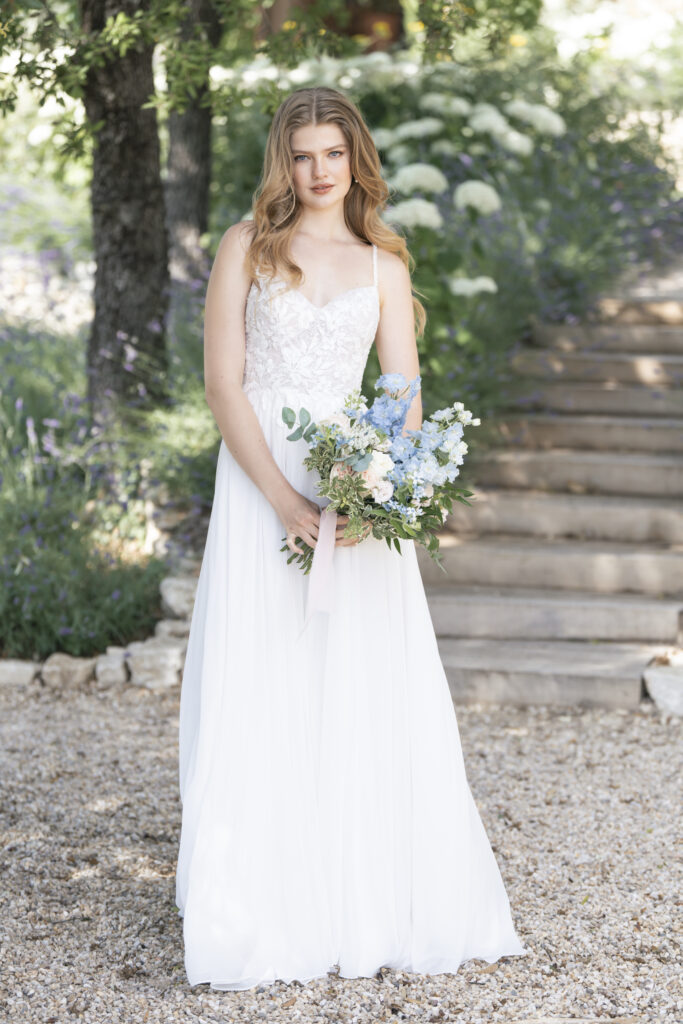 Fabric is Chiffon & Lace, silhouette is A-line, neckline is Sweetheart, sleeve style is Spaghetti Straps, train is Chapel, waistline is Natural, embellishment is Beaded Lace Appliqué, back is Low Scoop with Buttons, color is Ivory/Champagne/Nude, style is Romantic Garden, Lightweight, ethereal flow
