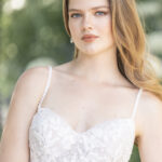 Fabric is Chiffon & Lace, silhouette is A-line, neckline is Sweetheart, sleeve style is Spaghetti Straps, train is Chapel, waistline is Natural, embellishment is Beaded Lace Appliqué, back is Low Scoop with Buttons, color is Ivory/Champagne/Nude, style is Romantic Garden, Lightweight, ethereal flow