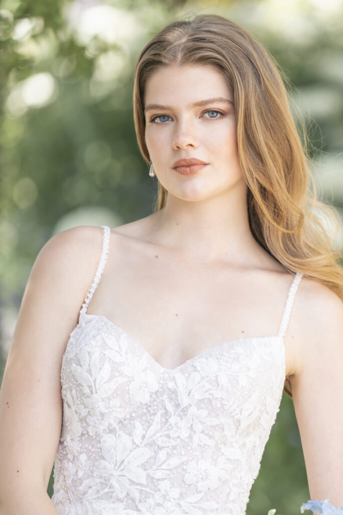 Fabric is Chiffon & Lace, silhouette is A-line, neckline is Sweetheart, sleeve style is Spaghetti Straps, train is Chapel, waistline is Natural, embellishment is Beaded Lace Appliqué, back is Low Scoop with Buttons, color is Ivory/Champagne/Nude, style is Romantic Garden, Lightweight, ethereal flow