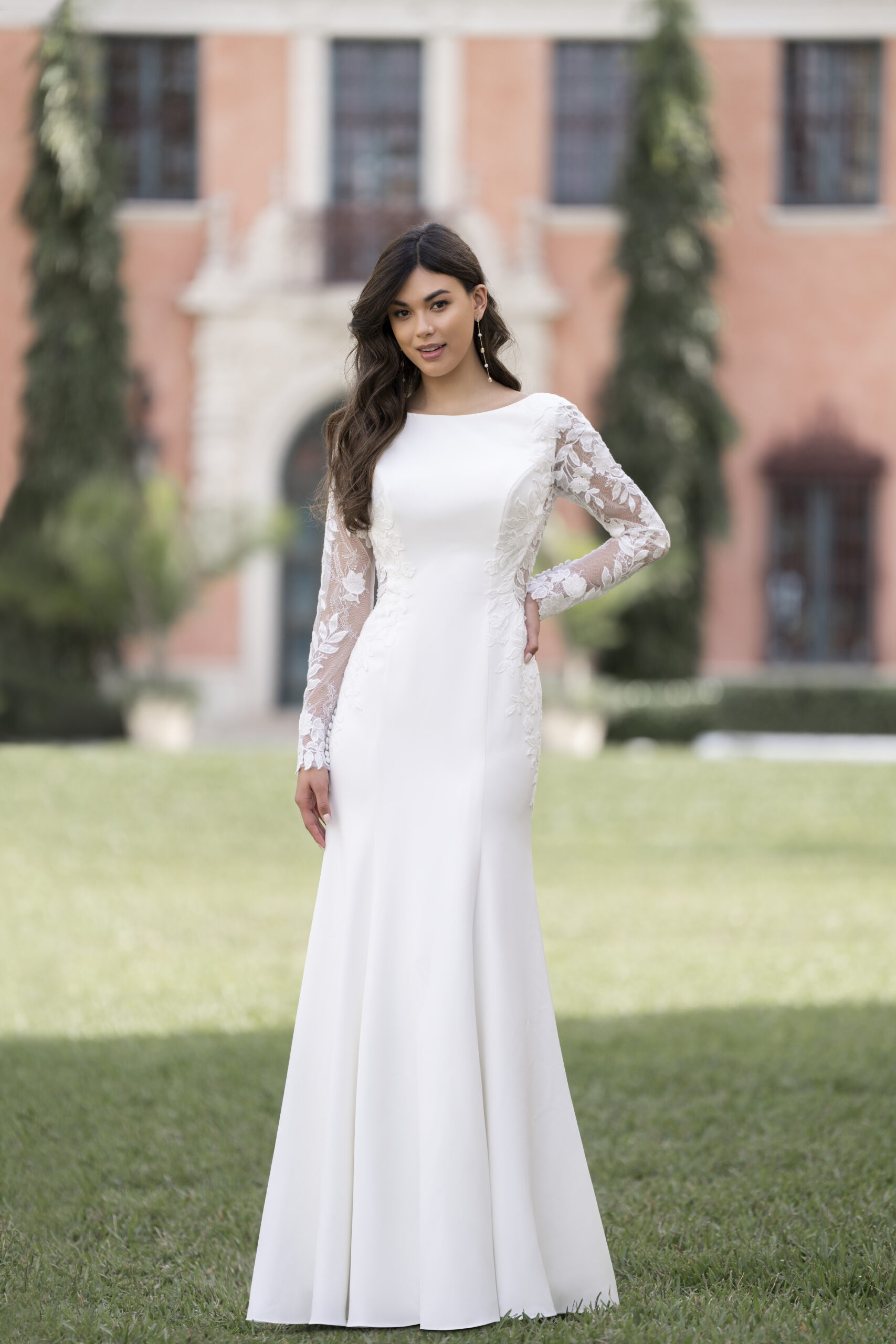 R3851 01 Fabric is Crepe & Lace, silhouette is Sheath, neckline is High Neckline, sleeve style is Long Lace, train is Sweep Train, waistline is Natural, embellishment is Lace Appliqué, back is Low Scoop, color is Ivory/Nude, style is Minimalist Elegance, Buttons down the back