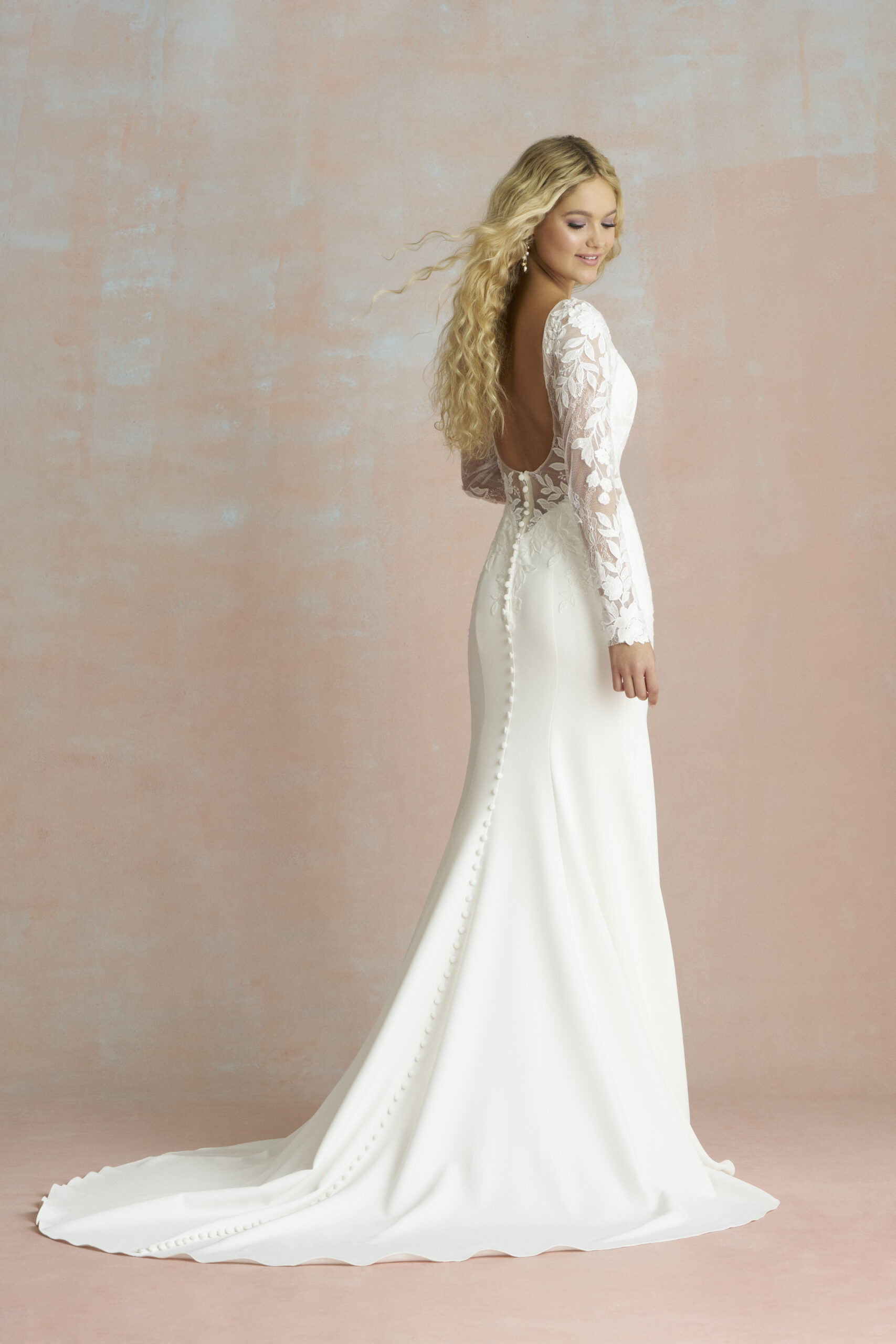 R3851 Studio 03 Fabric is Crepe & Lace, silhouette is Sheath, neckline is High Neckline, sleeve style is Long Lace, train is Sweep Train, waistline is Natural, embellishment is Lace Appliqué, back is Low Scoop, color is Ivory/Nude, style is Minimalist Elegance, Buttons down the back