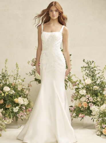 Fabric is Satin, silhouette is Fit and Flare, neckline is Square, sleeve style is Tank Straps, train is Chapel, waistline is Natural, embellishment is Beaded Lace Appliqué, back is Scoop with Buttons, color is Ivory, style is Modern Classic, Clean lines, elegant structure, subtle shimmer