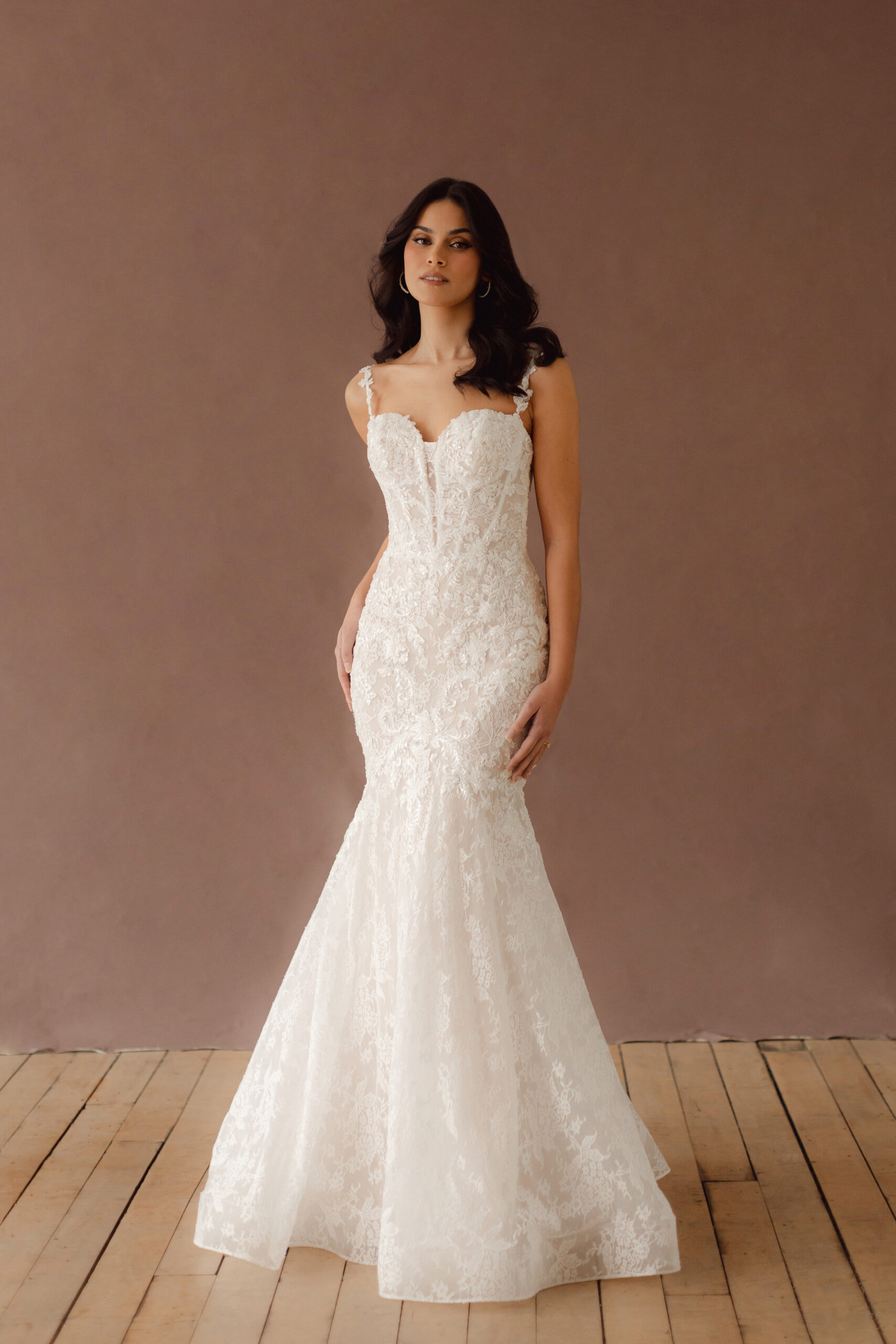 Fabric is Lace & Tulle, silhouette is Fit and Flare, neckline is Sweetheart, sleeve style is Convertible straps, train is Chapel, waistline is Natural, embellishment is 3D Floral Lace, Beading, back is Illusion Sheer Back, color is Ivory/Nude, style is Romantic, Modern Lace, Convertible floral straps (on-shoulder or off-the-shoulder); sculpted corset bodice