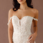 Fabric is Lace & Tulle, silhouette is Fit and Flare, neckline is Sweetheart, sleeve style is Convertible straps, train is Chapel, waistline is Natural, embellishment is 3D Floral Lace, Beading, back is Illusion Sheer Back, color is Ivory/Nude, style is Romantic, Modern Lace, Convertible floral straps (on-shoulder or off-the-shoulder); sculpted corset bodice
