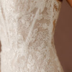Fabric is Lace & Tulle, silhouette is Fit and Flare, neckline is Sweetheart, sleeve style is Convertible straps, train is Chapel, waistline is Natural, embellishment is 3D Floral Lace, Beading, back is Illusion Sheer Back, color is Ivory/Nude, style is Romantic, Modern Lace, Convertible floral straps (on-shoulder or off-the-shoulder); sculpted corset bodice