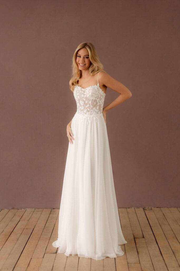 Fabric is Chiffon & Lace, silhouette is A-line, neckline is Scoop, sleeve style is Spaghetti Straps, train is Chapel, waistline is Natural, embellishment is Floral Lace Appliqué, back is Low Back, color is Ivory, style is Romantic Boho, Sheer bodice, Light sparkle