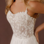 Fabric is Chiffon & Lace, silhouette is A-line, neckline is Scoop, sleeve style is Spaghetti Straps, train is Chapel, waistline is Natural, embellishment is Floral Lace Appliqué, back is Low Back, color is Ivory, style is Romantic Boho, Sheer bodice, Light sparkle