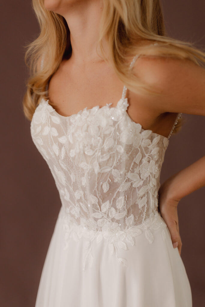 Fabric is Chiffon & Lace, silhouette is A-line, neckline is Scoop, sleeve style is Spaghetti Straps, train is Chapel, waistline is Natural, embellishment is Floral Lace Appliqué, back is Low Back, color is Ivory, style is Romantic Boho, Sheer bodice, Light sparkle