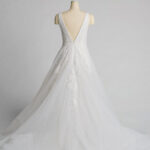 Fabric is Tulle & Lace, silhouette is A-Line, neckline is Deep V-Neck, sleeve style is Sleeveless, train is Chapel Train, waistline is Natural Waist, embellishment is Floral Appliqué, Beading, back is Deep V-Back, color is Soft Ivory, style is Romantic Elegance, Illusion Bodice, Sheer Detailing
