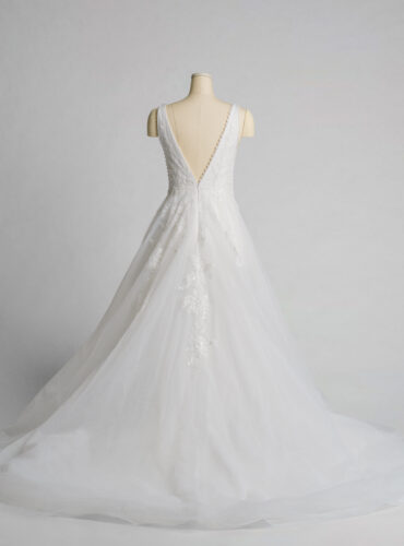 Fabric is Tulle & Lace, silhouette is A-Line, neckline is Deep V-Neck, sleeve style is Sleeveless, train is Chapel Train, waistline is Natural Waist, embellishment is Floral Appliqué, Beading, back is Deep V-Back, color is Soft Ivory, style is Romantic Elegance, Illusion Bodice, Sheer Detailing