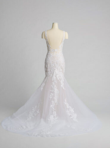 Fabric is Tulle & Lace, silhouette is Mermaid, neckline is Plunge V-neck, sleeve style is Sleeveless, train is Chapel, waistline is Natural, embellishment is Floral Lace Appliqué, back is Low Scoop, color is Ivory/Nude, style is Sexy Glam, Illusion bodice, fitted through hips, romantic floral detail