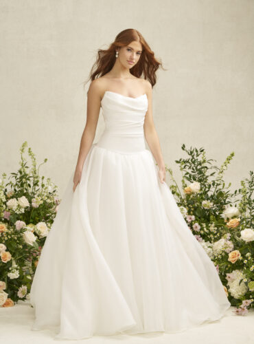 Fabric is Satin & Organza, silhouette is A-line, neckline is Scoop, sleeve style is Strapless, train is Chapel, waistline is Dropped, embellishment is Ruched Bodice, back is Covered Buttons, color is Ivory, style is Romantic Minimalism, Softly structured skirt