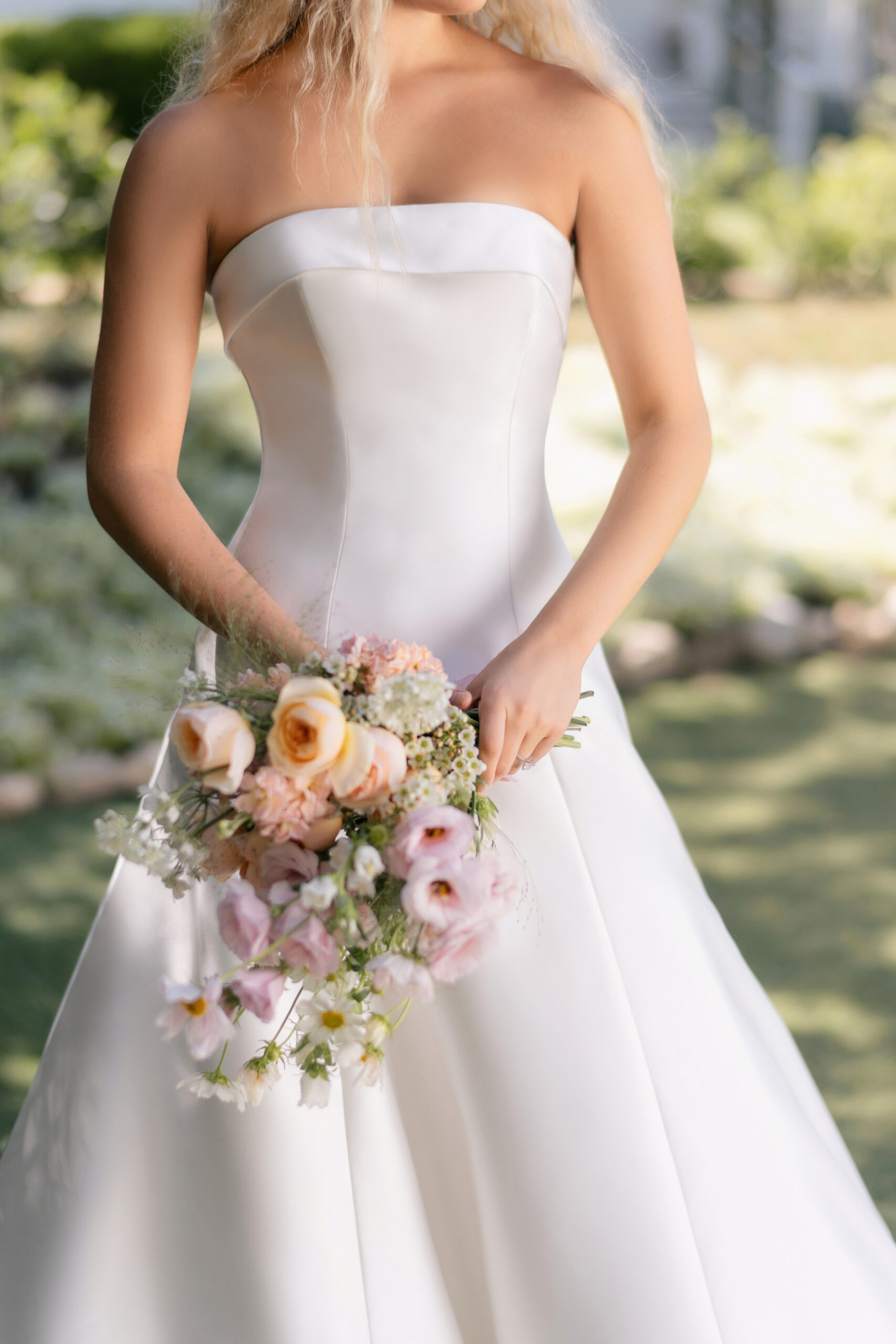 R3905 06 Fabric is Mikado, silhouette is A-line, neckline is Rolled strapless, sleeve style is Strapless, train is Chapel, waistline is Natural, embellishment is Minimalist, structured, back is Lace-up corset, color is Ivory, style is Modern classic, Clean lines, elegant tailoring