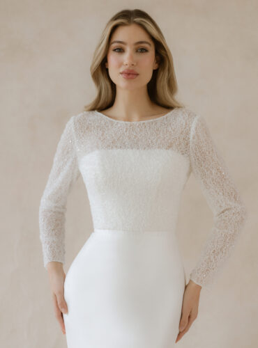 Fabric is Beaded lace / Sequin lace, silhouette is Fitted jacket, neckline is Bateau, sleeve style is Long sleeves, train is None, waistline is Natural, embellishment is Beading / Sequins, back is Buttoned back, color is Ivory, style is Classic elegance, Sheer overlay / Bridal jacket